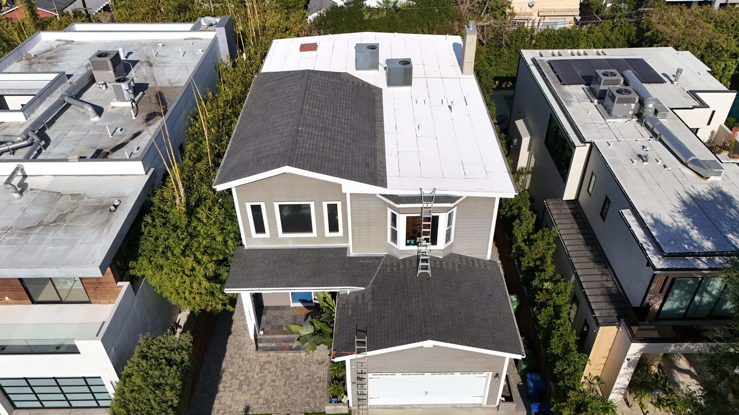 Storm damaged roof being assessed in Los Angeles after a wind event