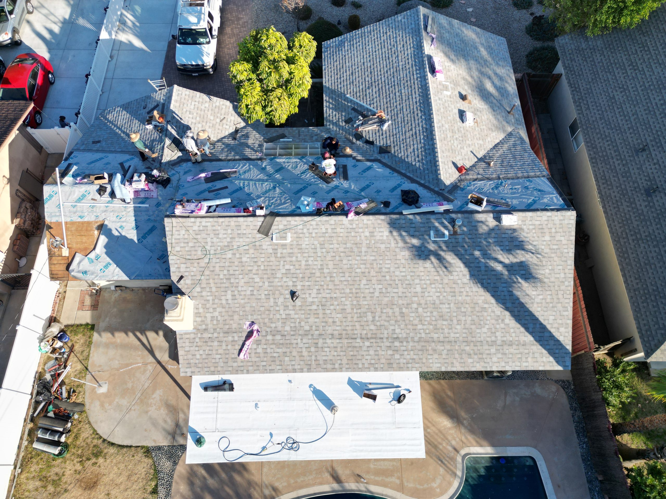 Tile roof completed by Los Angeles Roofing Masters above the LA skyline at sunset
