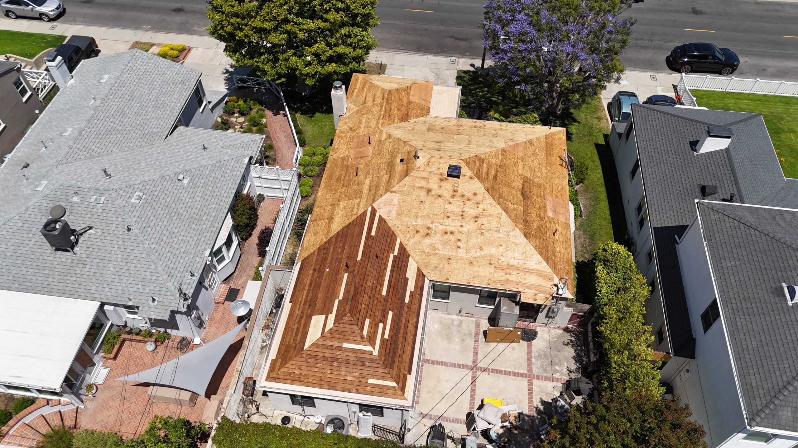 New solid sheathing being installed on a Los Angeles roof